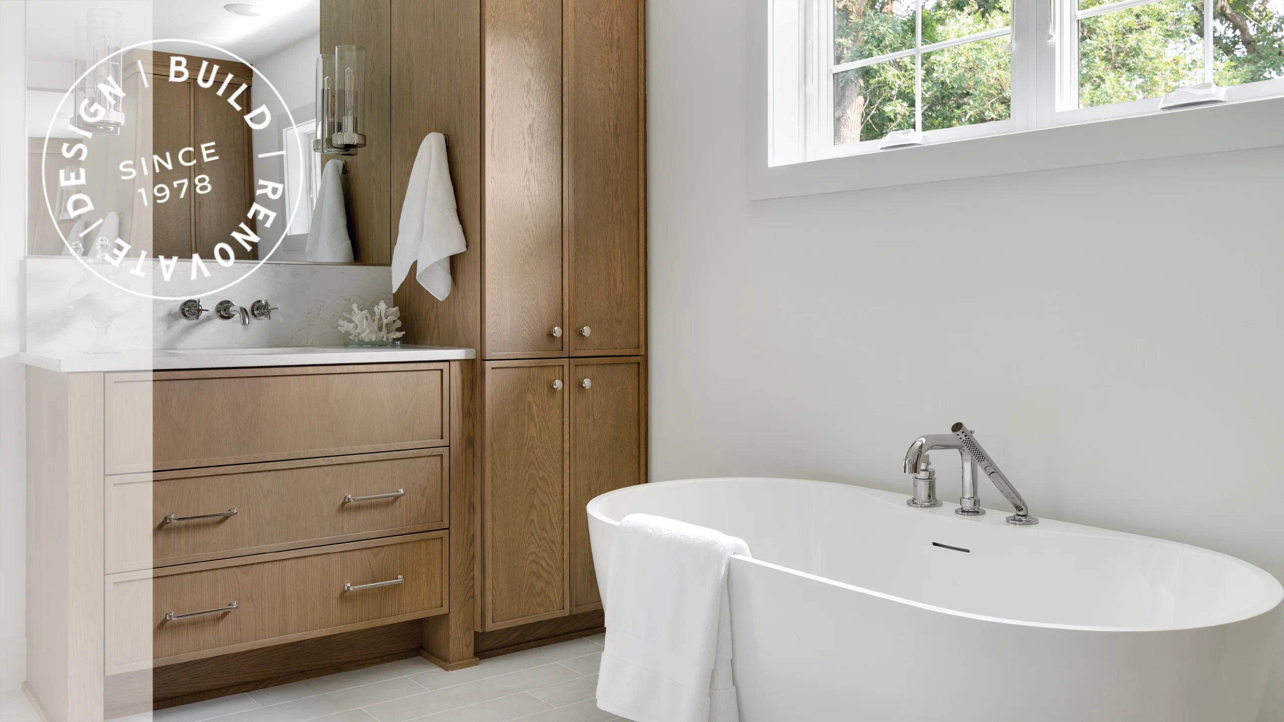 MCP blog header bathroom with warm wood vanity and freestanding tub